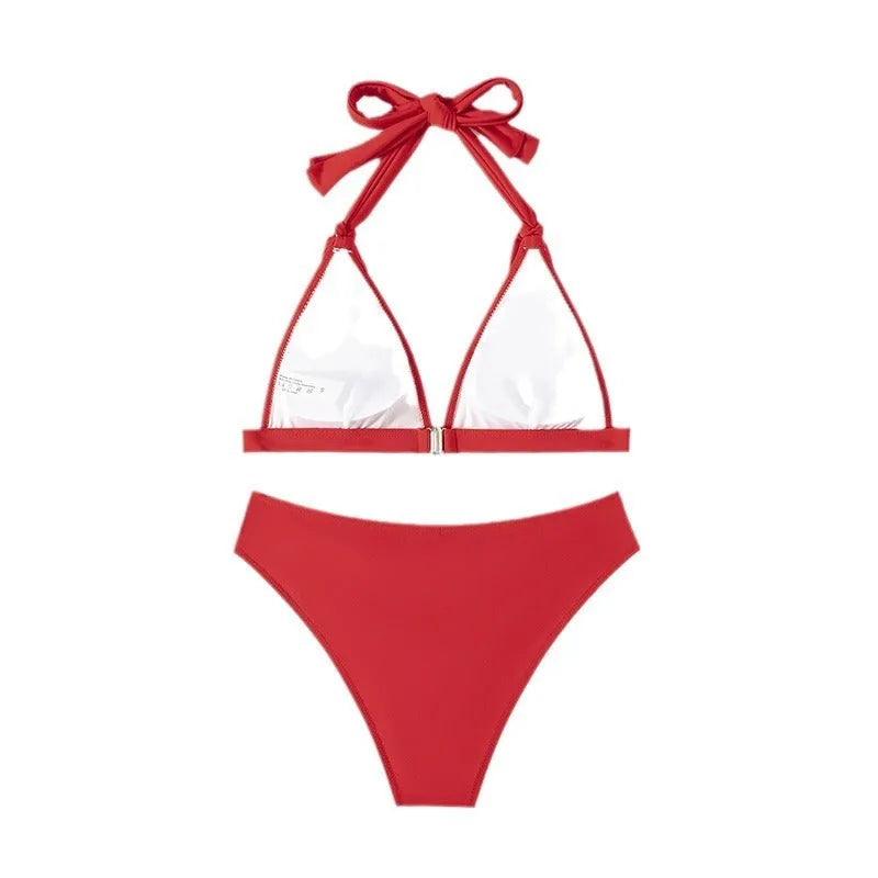 Red women's lace-up halterneck bikini top and shorts set on a mannequin