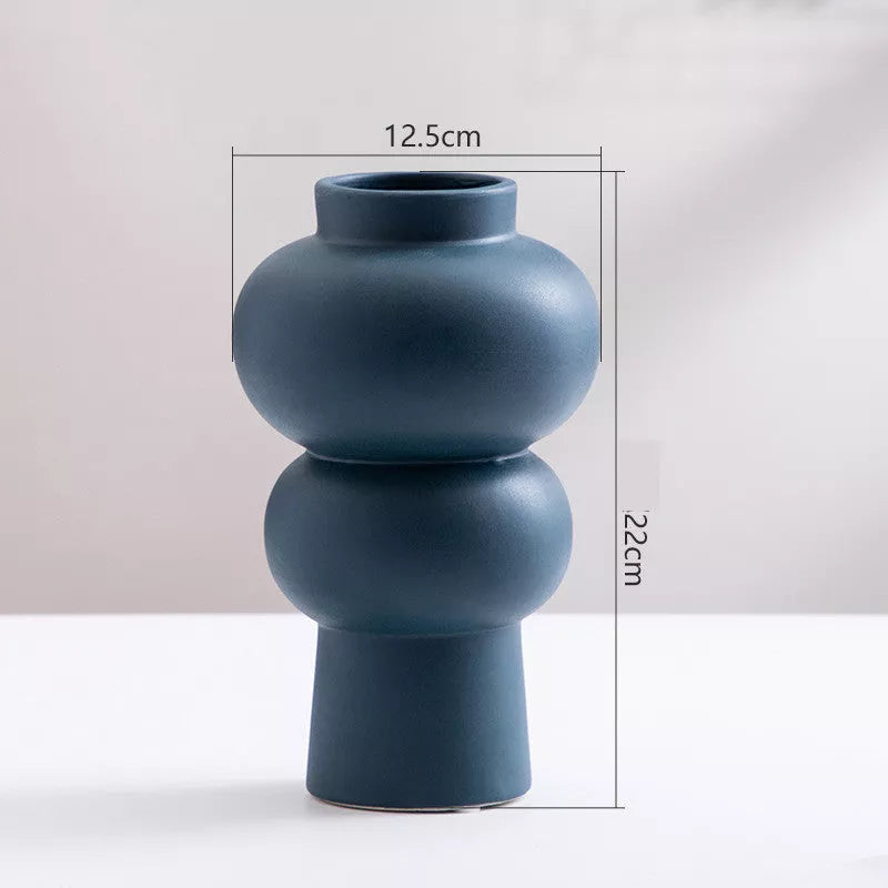 Nordic minimalist ceramic vase with glazed finish in blue, yellow, and orange options