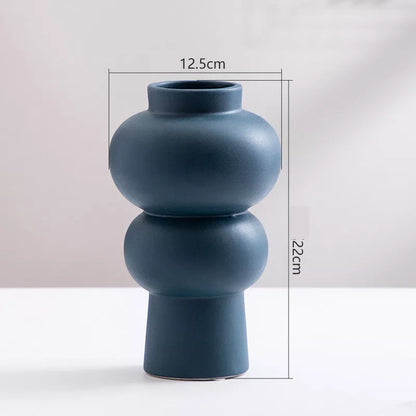 Nordic minimalist ceramic vase with glazed finish in blue, yellow, and orange options