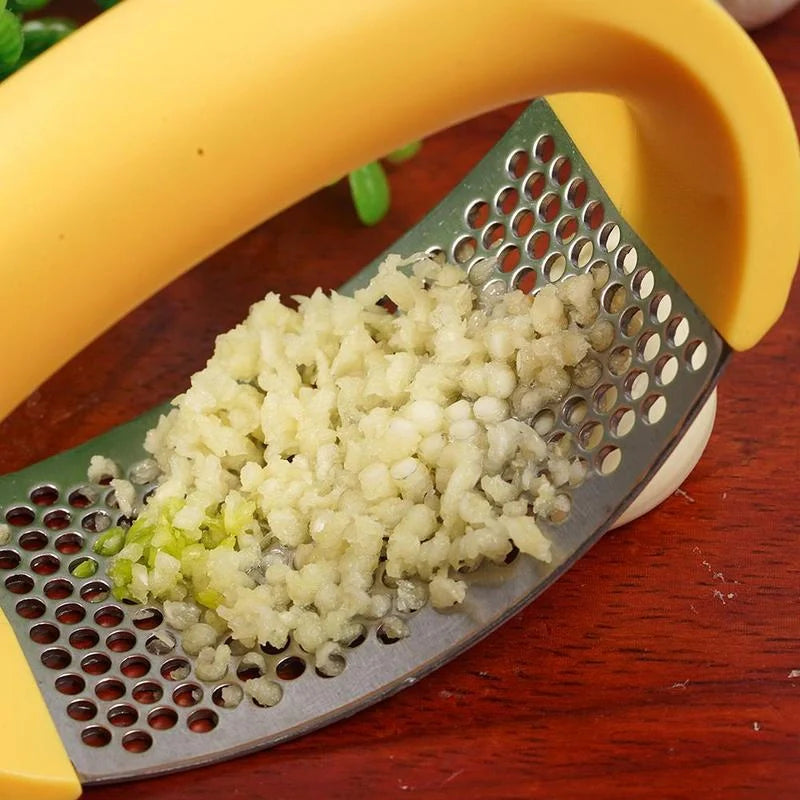 Stainless steel garlic press with non-slip handle for easy crushing