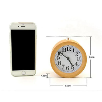 Solid beech wood analog alarm clock with silent snooze on a wooden bedside table