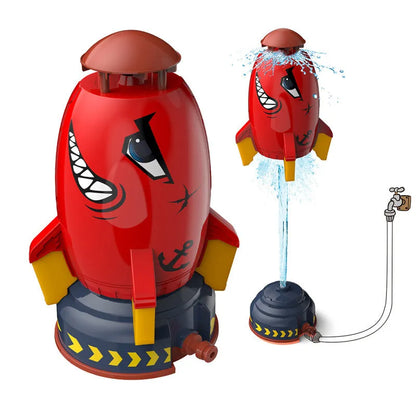 Yellow outdoor water pressure rocket launcher toy for kids on a green lawn.