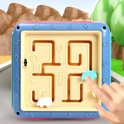 Colourful hexahedron educational toy with bead maze, gears, shape sorter, and clock face on different sides