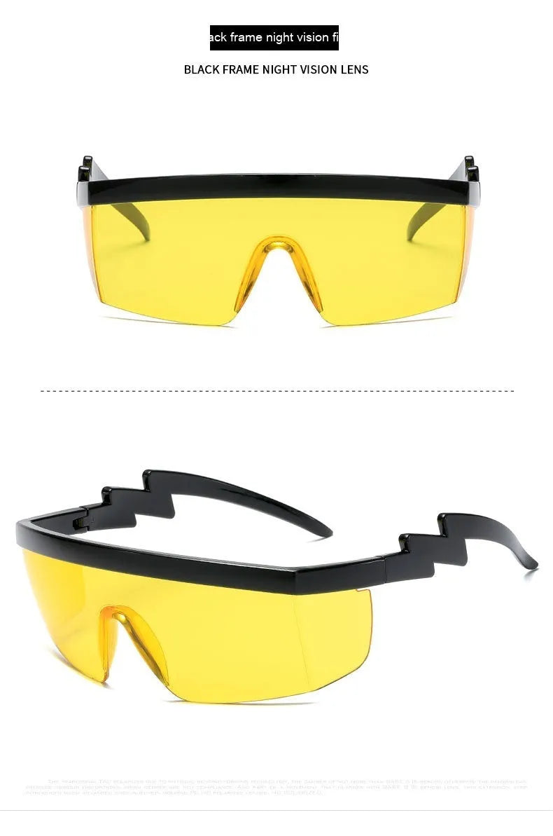 Black one-piece cycling sunglasses with blue polycarbonate lenses and lightning leg temples on a grey background.