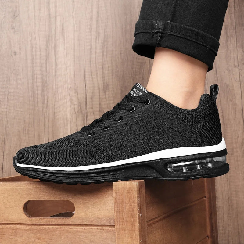 Casual Flyknit running shoes made with mesh uppers for breathable lightweight running, available in black, grey, red, and white colour options in sizes 36 to 46, featuring a PU sole and round toe design for active wear.