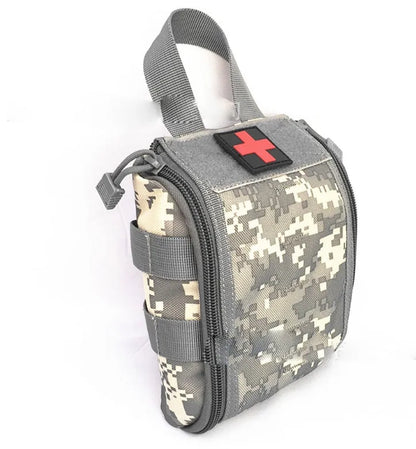 Tactical medical first aid kit open showing gauze, bandages, thermometer, and medicines for outdoor camping.
