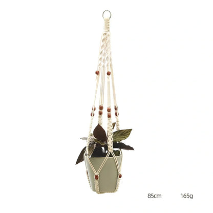 Hand-knitted cotton flowerpot net bag showing intricate pattern and hanging installation with plant