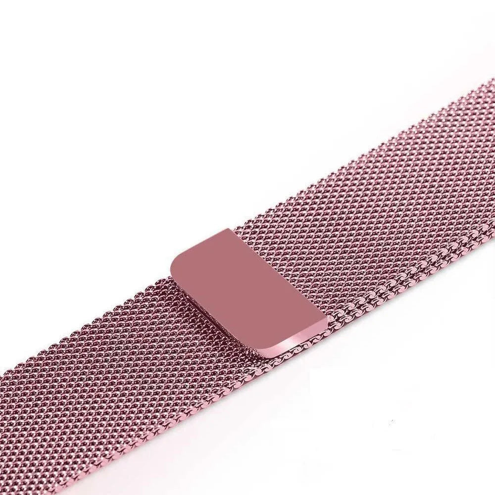 Stainless steel Apple Watch strap in silver on a wrist, showing the metal links and secure clasp.