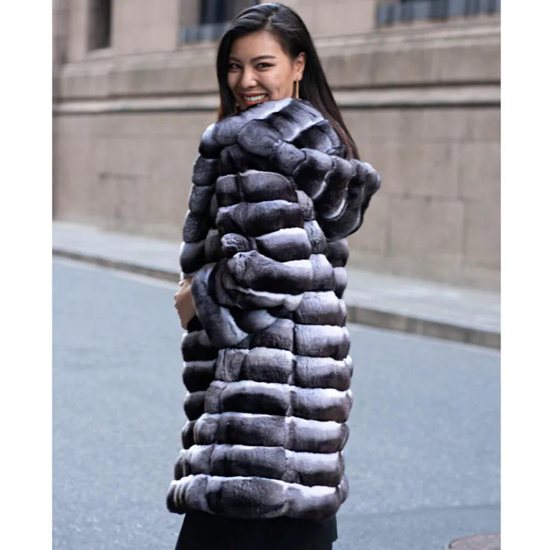 Women's zebra stripe pattern faux fur overcoat with regular sleeves, shown in a medium length.