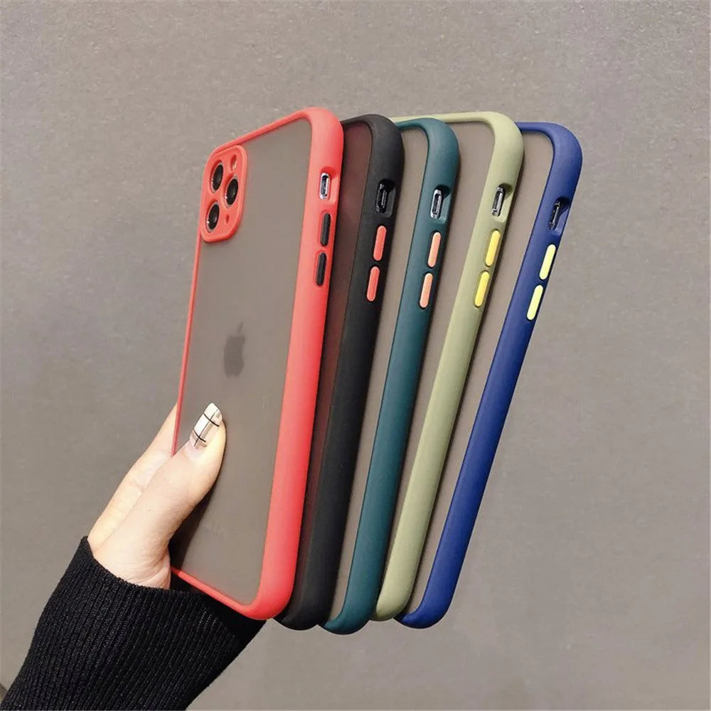 Solid colour silicone shockproof protective case for iPhone models on a table.