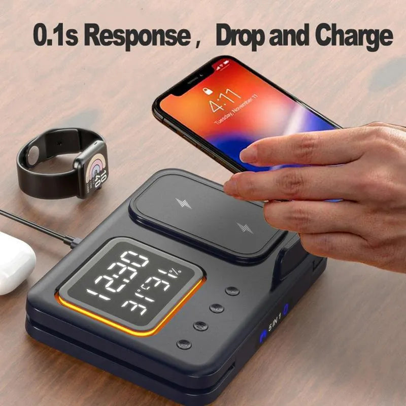 Black wireless charging station showing phone, watch and headphones charging, with digital clock display.