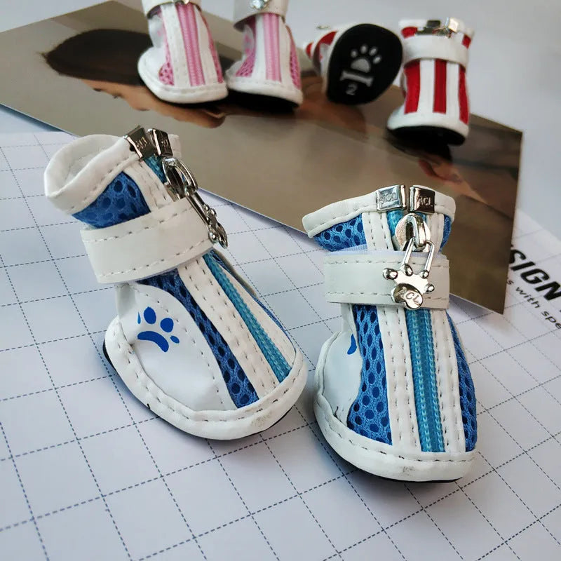 Blue dog shoes with front zipper closure and non-slip rubber soles for small pets.