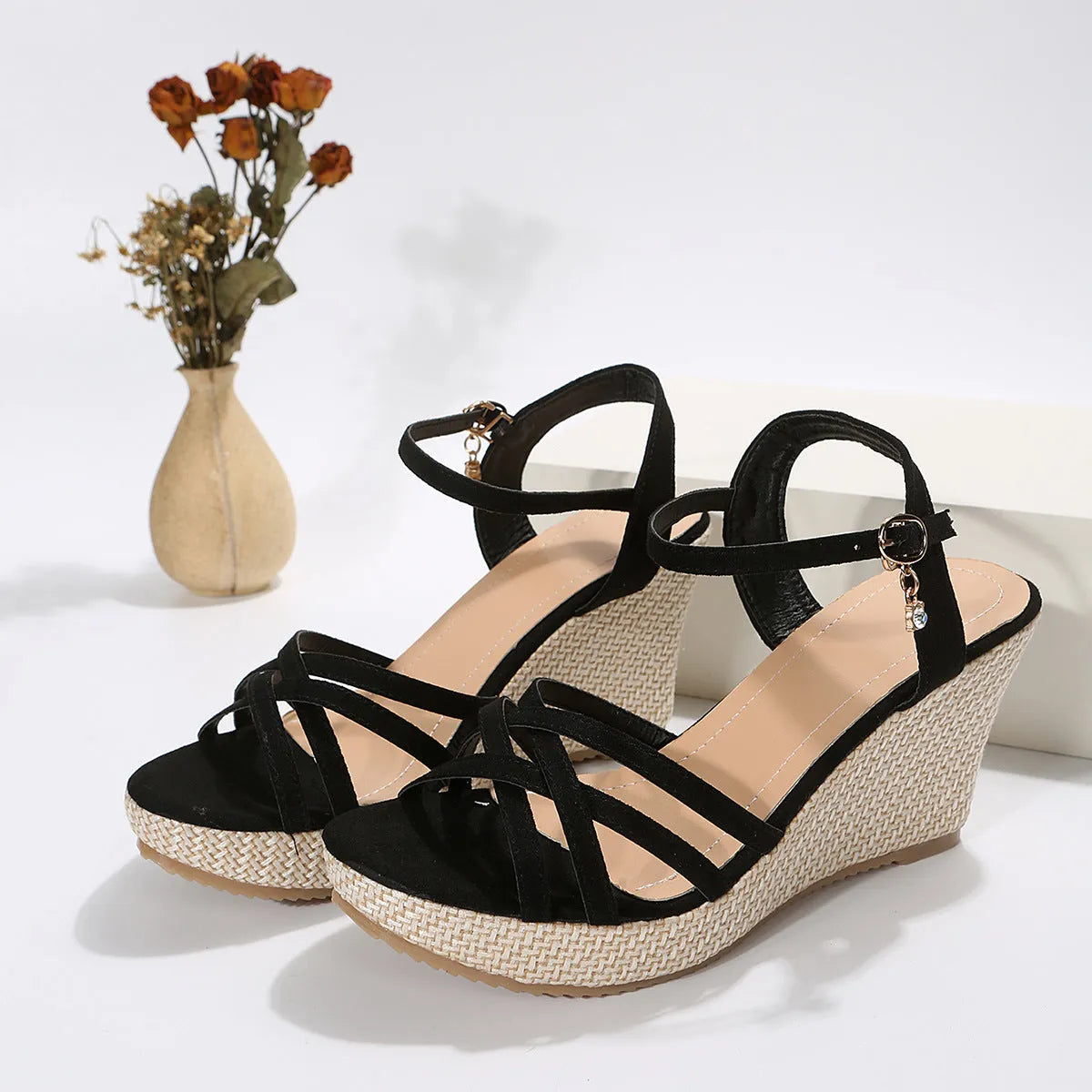 Women's black wedge sandals with a fish mouth toe bracket and fabric upper.