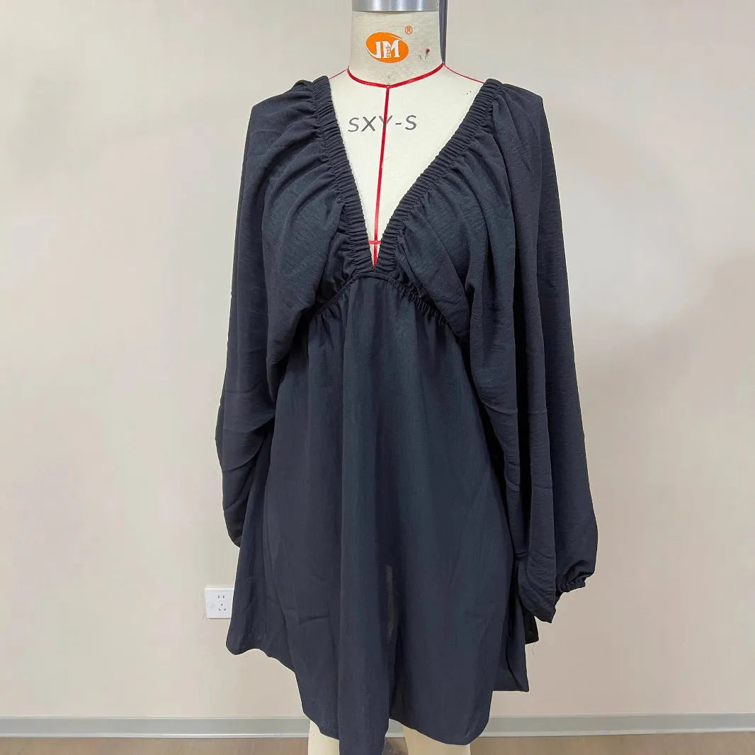 Women's apricot V-neck dress with long puff sleeves and a flounced swing skirt.