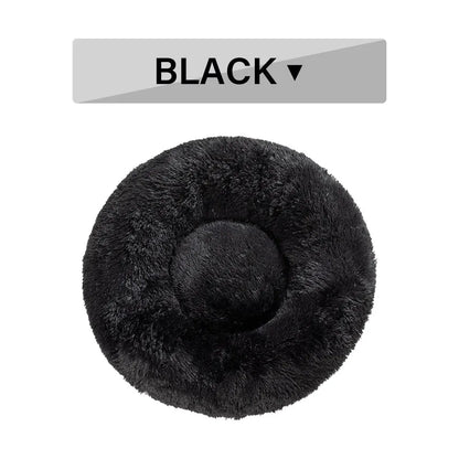 Fluffy donut-shaped pet bed with raised bolster edge in long plush material