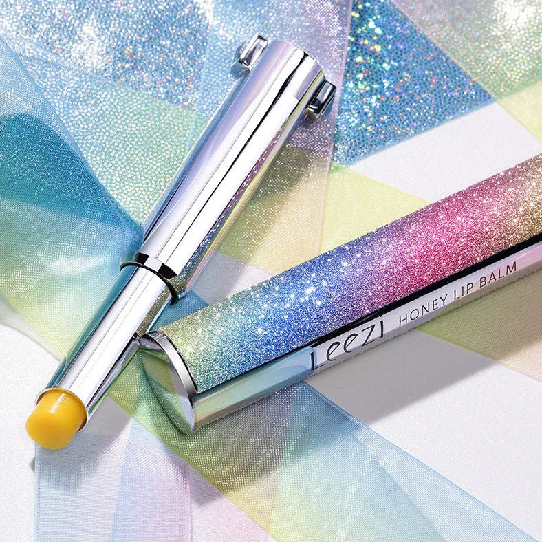 Rainbow Star colour changing lipstick tube showing honey shade transforming to pink on lips