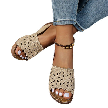 Women's wedge beach slippers with flower cutout design on PVC upper, shown in light brown colour.