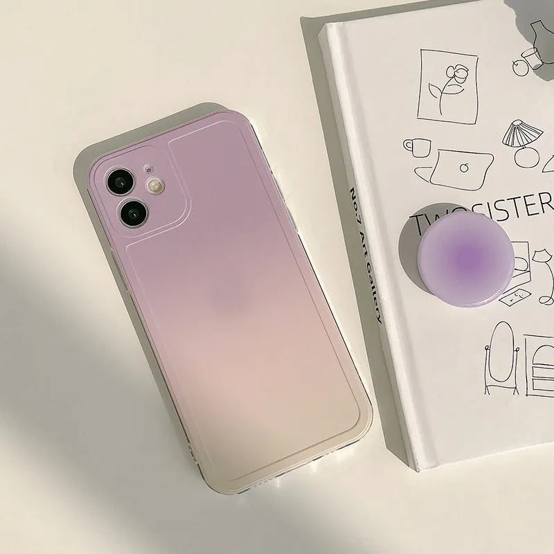 Yellow and purple gradient silicone iPhone case showing integrated airbag X bracket on the back.