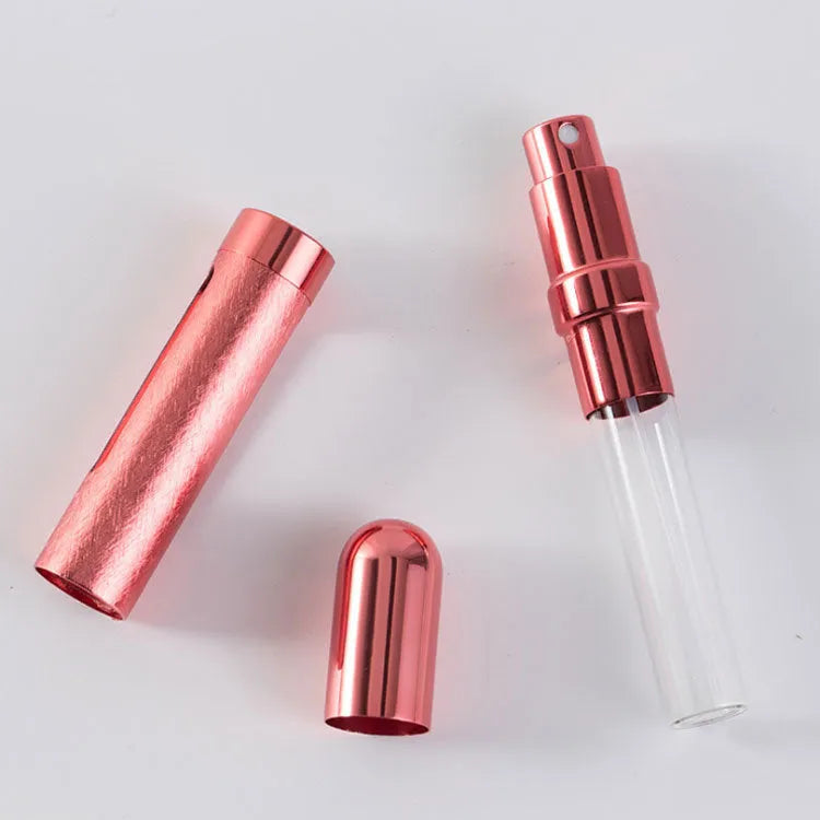 12ml portable aluminium perfume bottle refillable travel sprayer with glass liner, 115mm tall bullet-shaped design in six colour choices including blue, gold, pink, red, silver, and violet