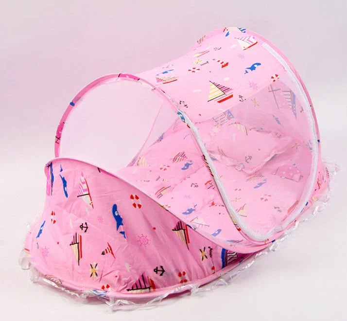 Breathable insect-free foldable baby travel cot with integrated mattress and pillow, available in blue, pink and blue-and-pink colour options