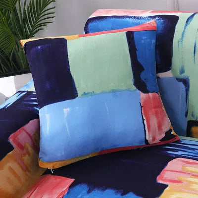 Printed stretchable sofa slipcover with geometric abstraction pattern on a three-seater sofa, showing tight fit and modern design.