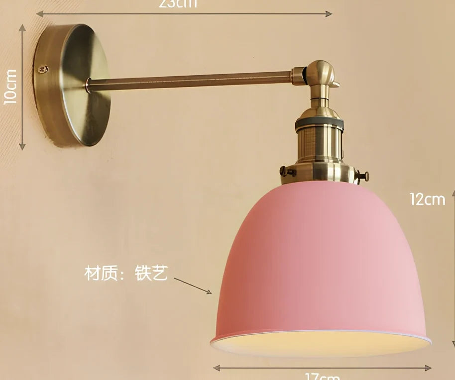 Bedroom wall light with 15cm wide iron shade in pink colour, mounted 20cm projection for soft illumination