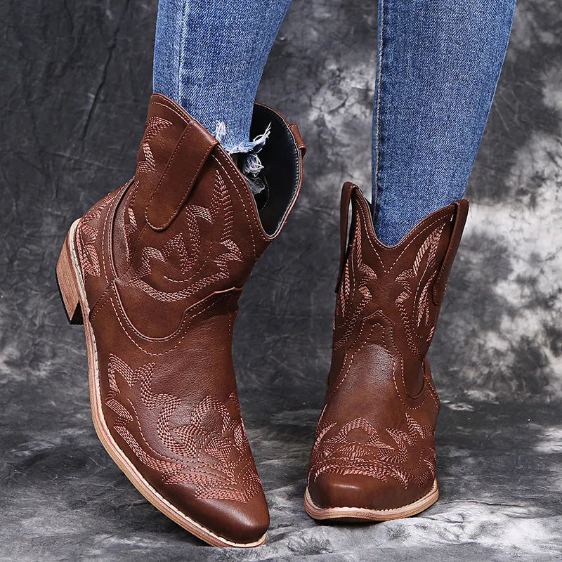 Cowboy boots for women with embroidery detail and a low wedge heel, offering a western-inspired style with sizes from EU 35 to 43 in blue, brown, and wine red.