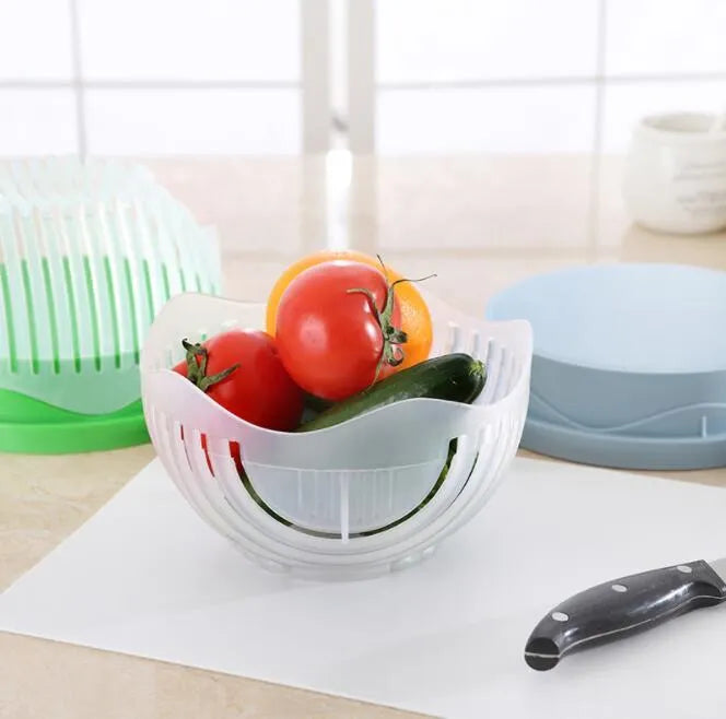 Blue salad cutter bowl showing cutting lid with seams, drain basket function, and reversible base plate