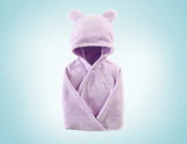 Blue hooded baby bath towel with dimensions 65cm by 110cm laid flat.
