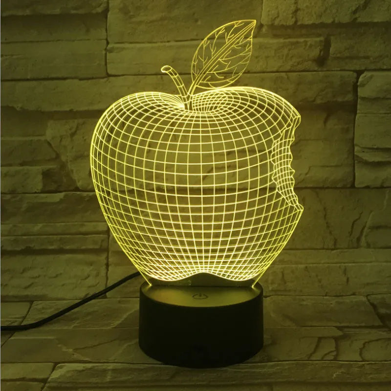 Colourful 3D fruit design LED night light with touch control on a table.