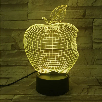 Colourful 3D fruit design LED night light with touch control on a table.