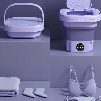 Green folding washing machine measuring 26x26x27cm with USB power cable and mechanical dial controls