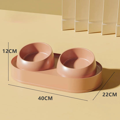 White elevated pet feeder with two tilted bowls on a non-slip base, for cat and small dog food and water.