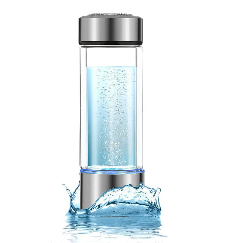 Portable hydrogen water bottle with glass chamber and stainless steel components showing electrolysis bubbles