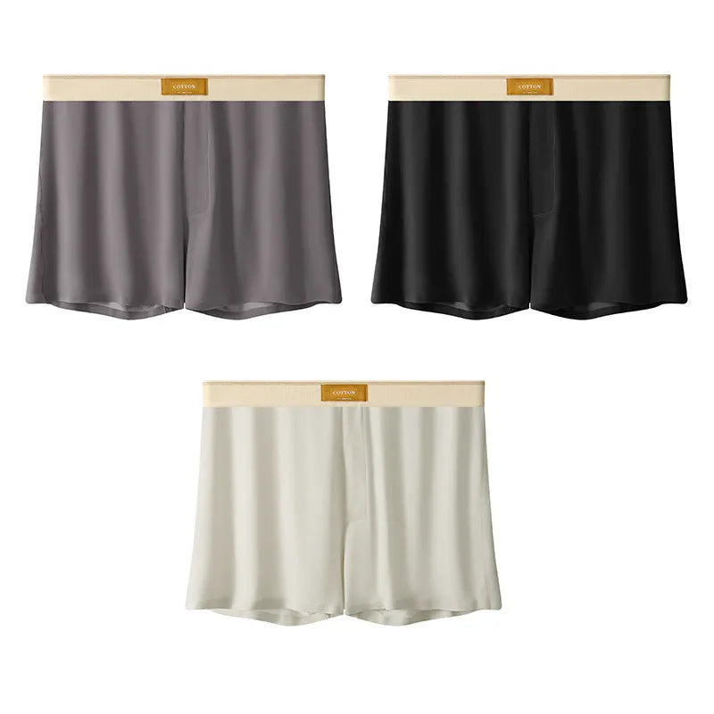 Pack of three pairs of solid colour men's ice silk briefs on a white background