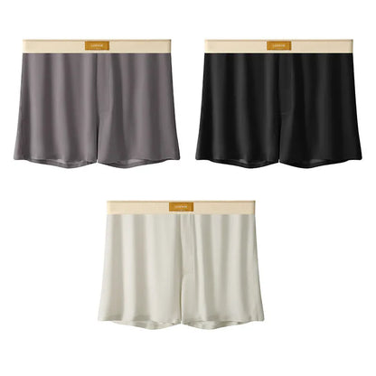 Pack of three pairs of solid colour men's ice silk briefs on a white background