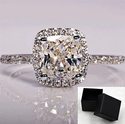 Women's silver colour alloy ring with artificial gemstone inlay and geometric design, bridal style.