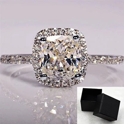 Women's silver colour alloy ring with artificial gemstone inlay and geometric design, bridal style.