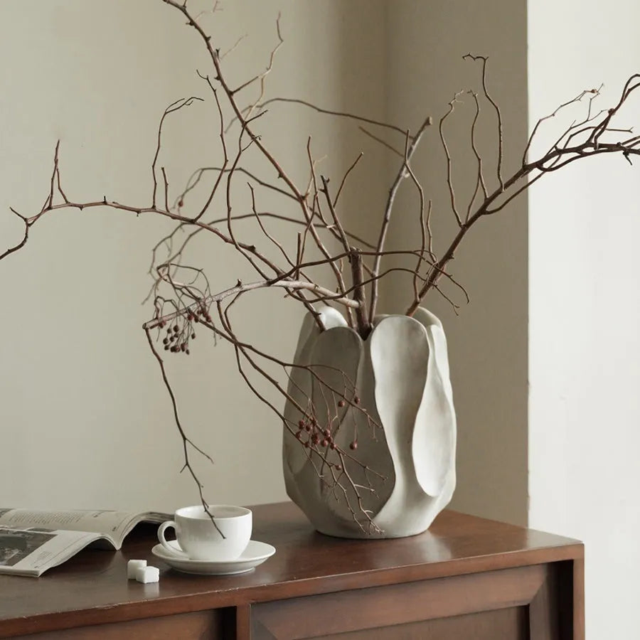 Hand-formed irregular ceramic vase measuring 25cm tall with 15cm diameter opening, made from magnesium clay