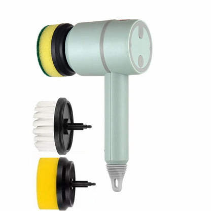 Green electric cleaning brush with multiple brush heads on a kitchen worktop.