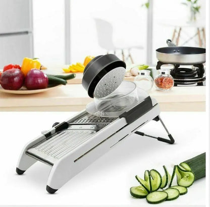 White kitchen vegetable slicer with stainless steel blades and adjustable thickness settings