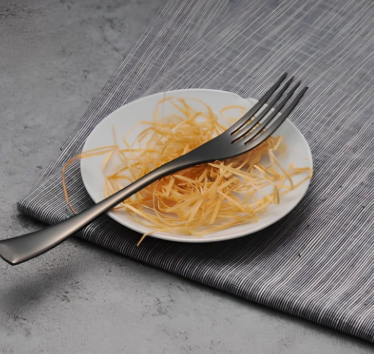Black stainless steel cutlery set with mirror polish finish showing fork, knife, coffee spoon, soup spoon, steak knife