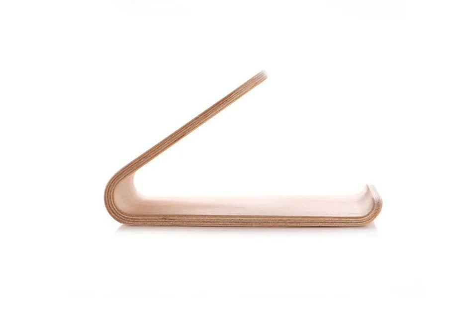 Solid wooden iPhone stand in Walnut finish on a desk, holding a mobile phone.