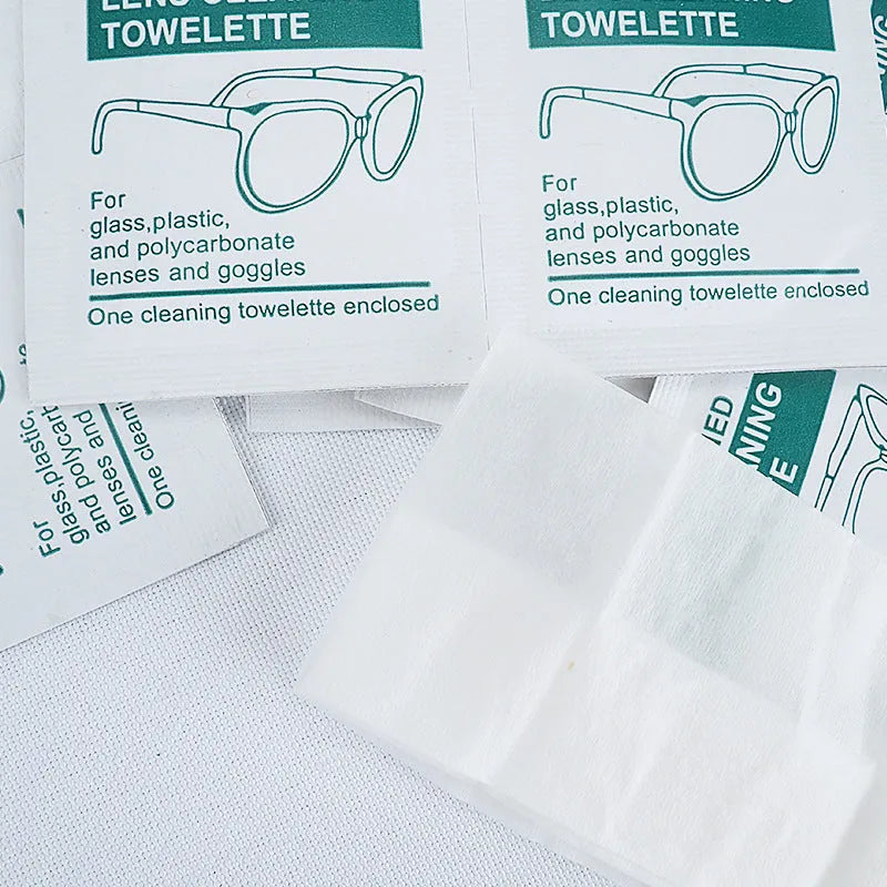 Pack of 100 white, individually sealed quick-drying lens cleaning wipes for glasses and screens.