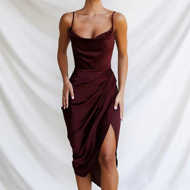 A high-waisted satin midi skirt with a side slit, shown in a solid colour.