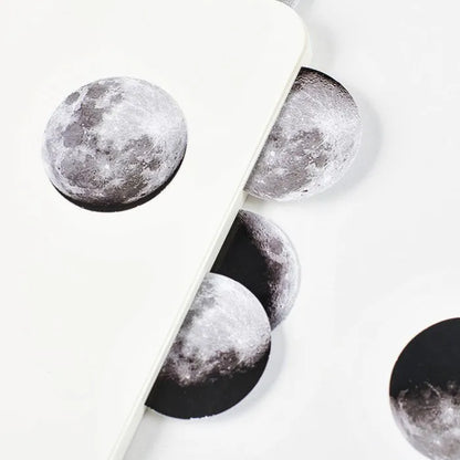 Box containing 45 black moon phases and calendar planet decorative stickers on self-adhesive paper.
