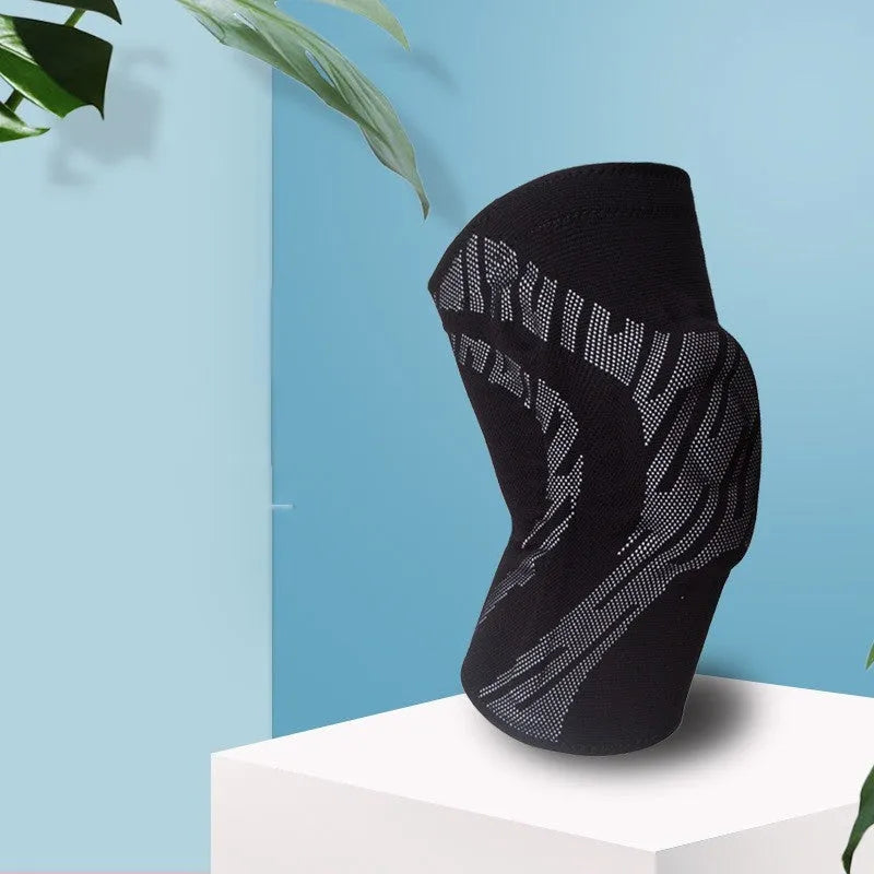 Black nylon basketball knee pads with adjustable straps shown on a knee