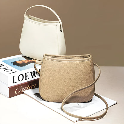 Women's genuine cowhide leather messenger bag showing organisational compartments and sandwich pockets in neutral colour