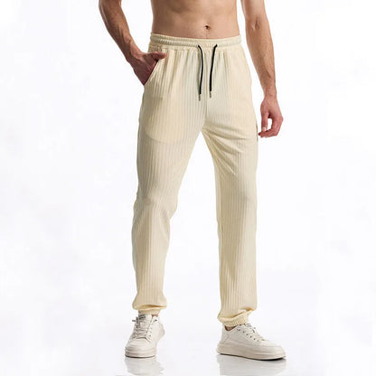 Silky rib fabric baggy straight-leg casual trousers with an elastic drawstring waist in khaki colour.