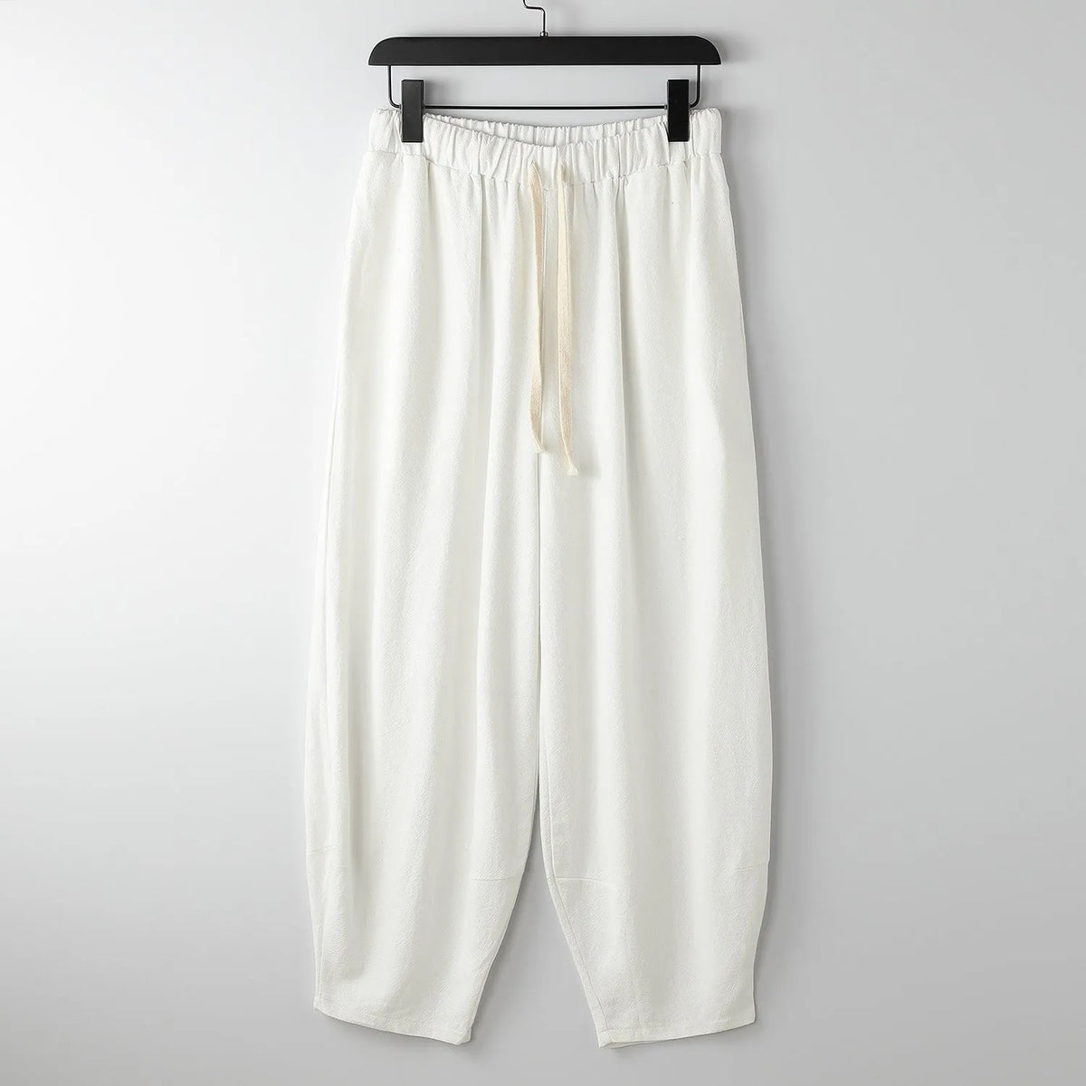 Loose linen harem pants with ankle ties in neutral colours for plus sizes